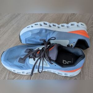 On Running Blue and Orange Athletic Shoes with Cushioned Sole